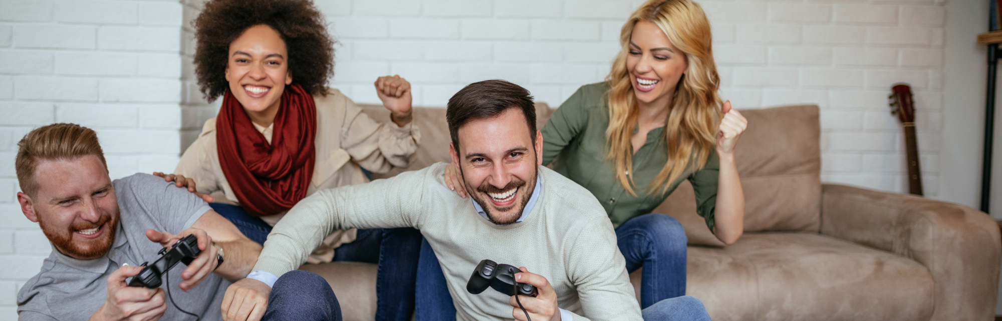 Four adults gathering playing video game