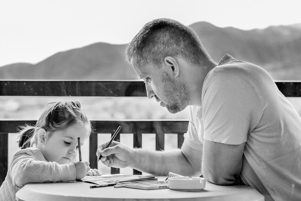 Father and daughter coloring.