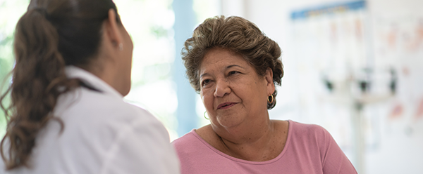 Woman speaking to a doctor