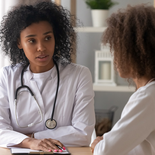 Woman talking with her doctor.