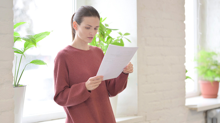 Mother reading paperwork