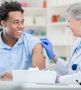 Man getting vaccinated by doctor