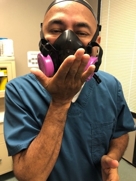 Respiratory Therapist conducts mask fit testing with a negative pressure test