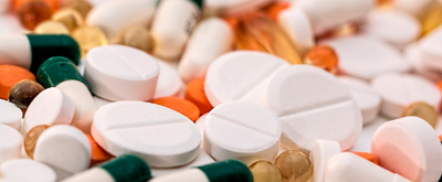Assortment of prescription drug tablets and capsules.